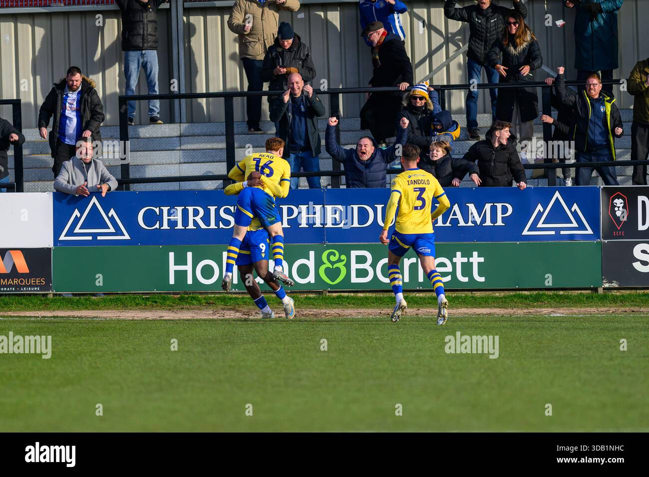 Arthur Read of Colchester United celebrates scoring his side's third ...