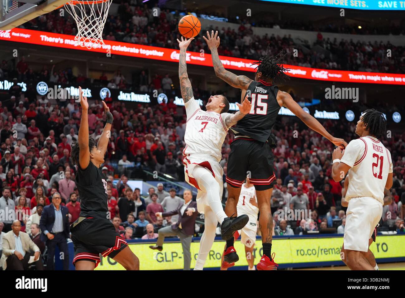 Arkansas forward Trevon Brazile (7) shoots against Texas Tech defenders ...