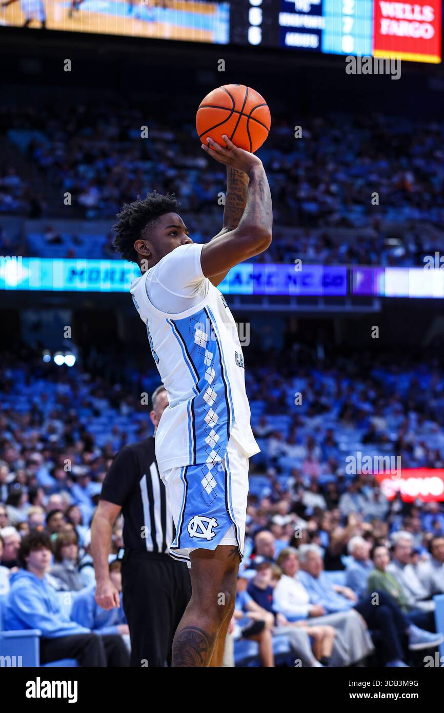 December 13, 2025: North Carolina guard Jaydon Young (4) hits jumper ...
