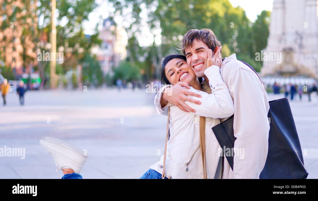 Happy diverse couple embracing outdoors Stock Photo