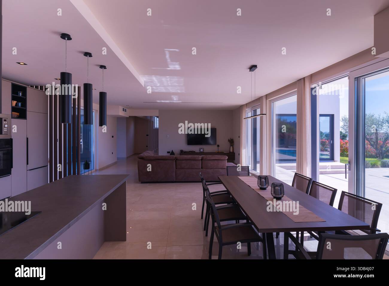 Modern open-plan living and dining room in a luxury villa with large ...