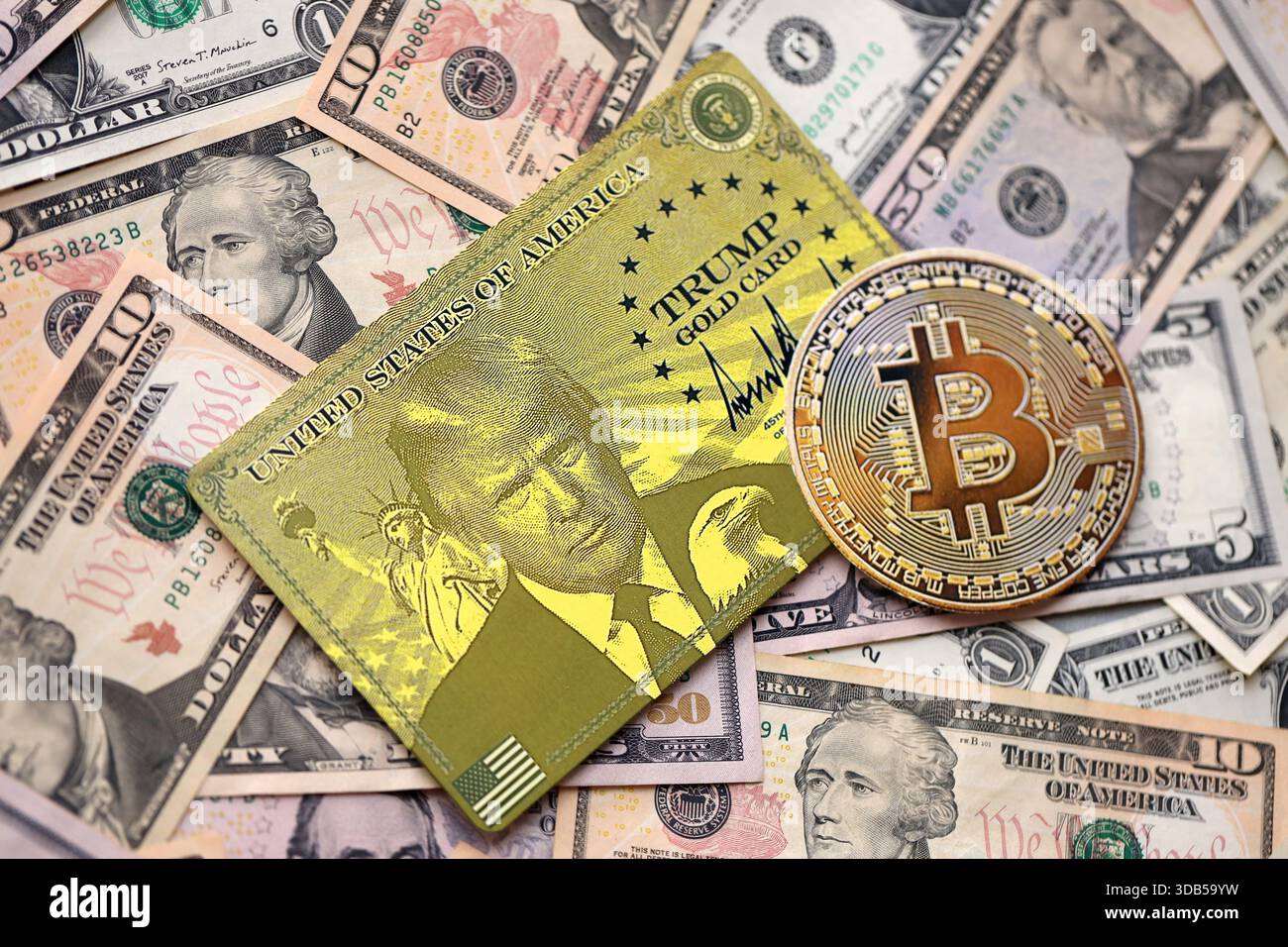 KYIV, UKRAINE - DECEMBER 13, 2025 Trump gold card and bitcoin on big amount  of US dollar money bills banknotes close up Stock Photo - Alamy