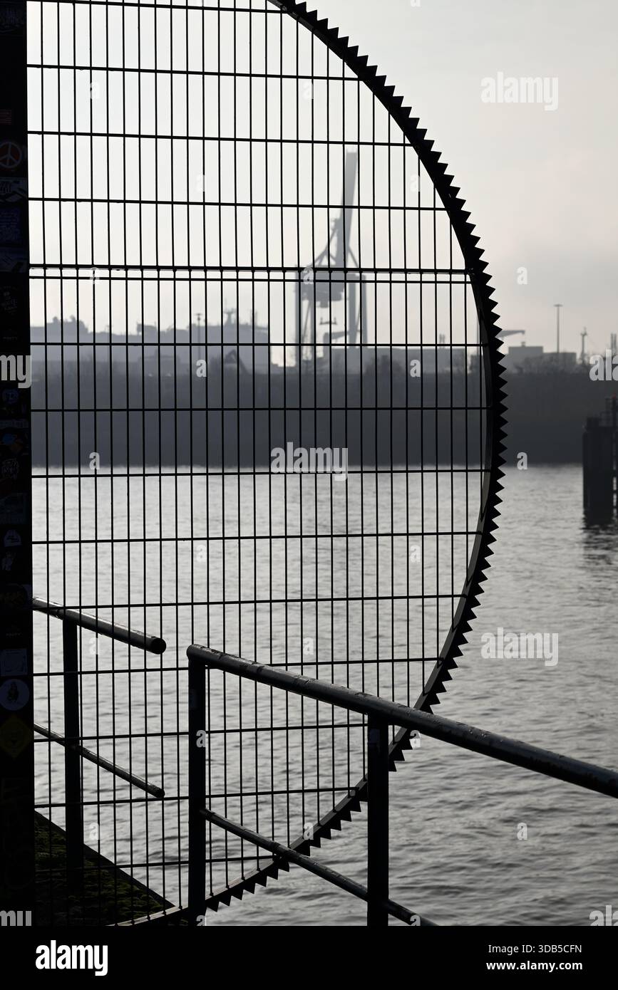 Detail of security fence in Harbor. Hamburg Hafencity. Silhouette of security fence. Stock Photo