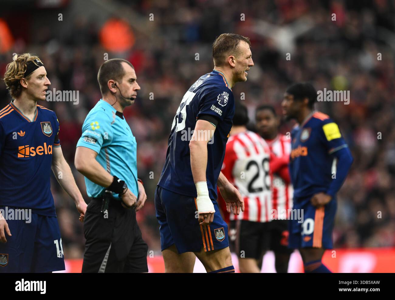 dan-burn-for-newcastle-united-goes-off-with-an-injury-during-the