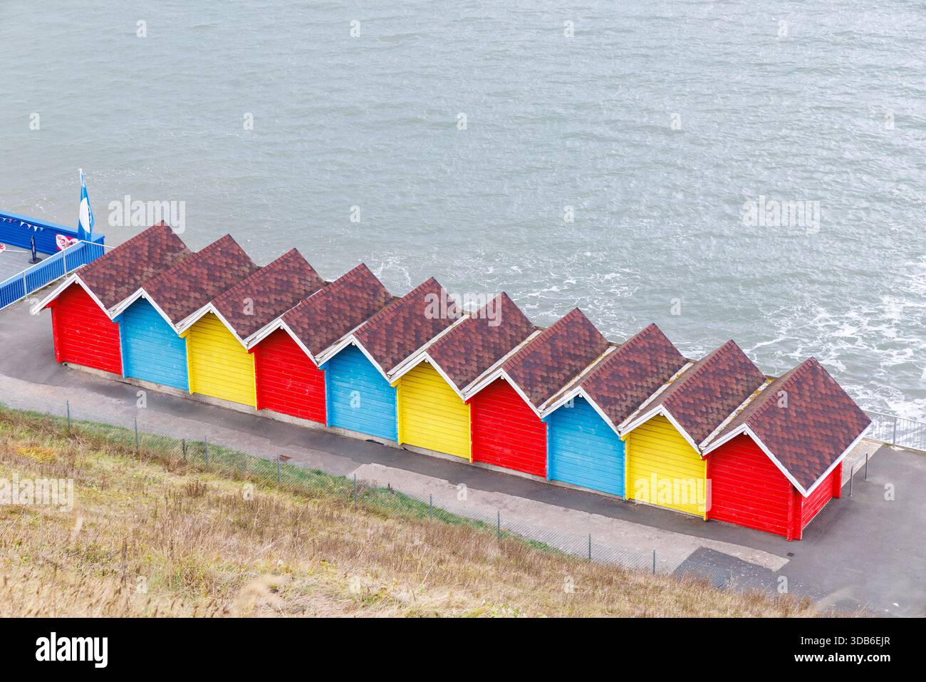 Brightly painted beach huts, Whitby, Yorkshire, England, UK Stock Photo