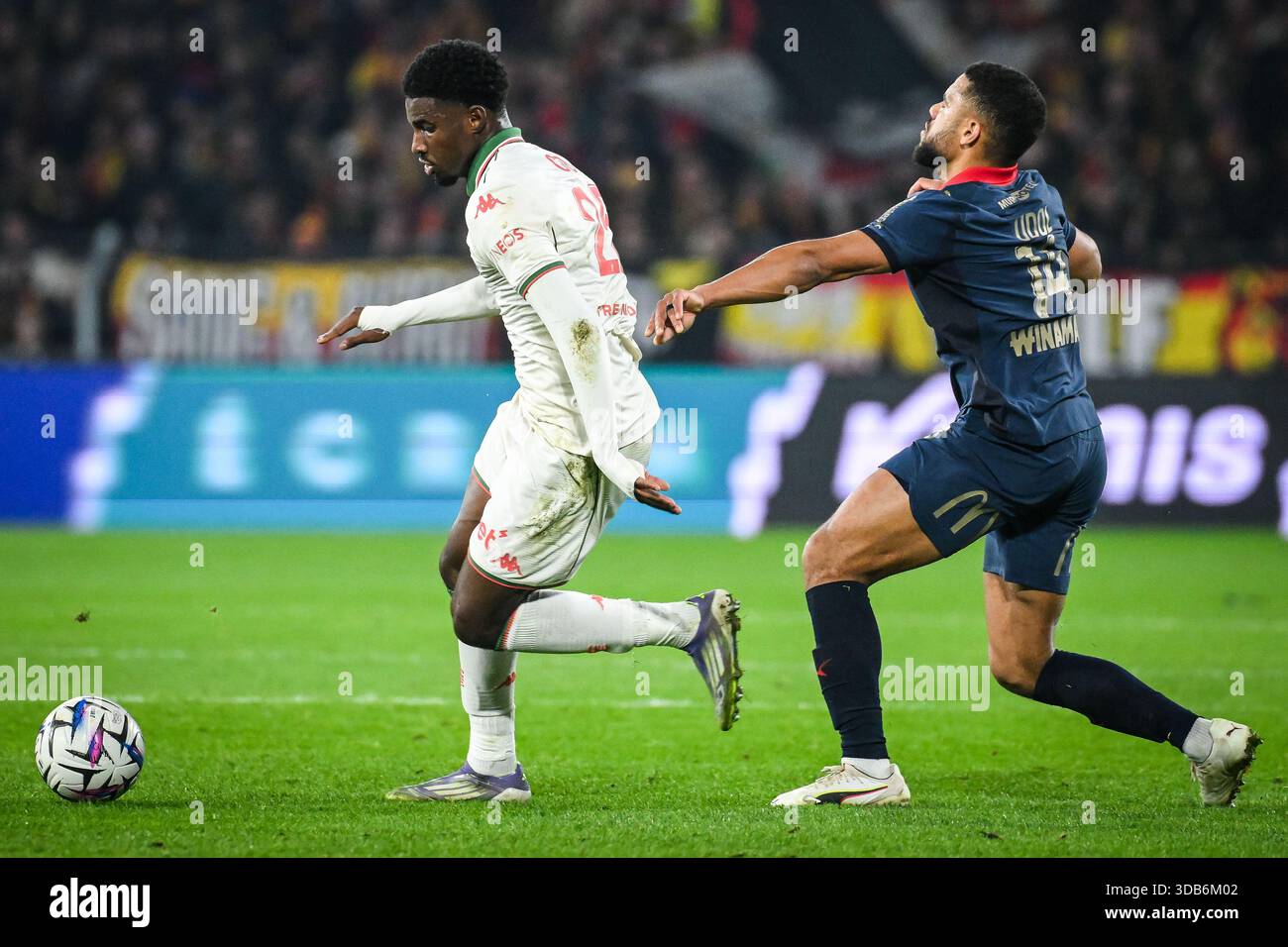 Mohamed-Ali CHO of Nice and Matthieu UDOL of Lens during the French ...