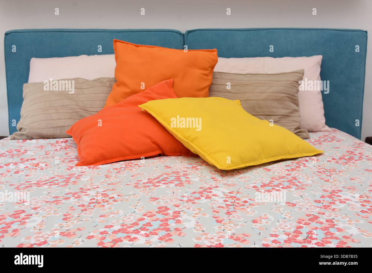 cushions representing autumn placed on the bed Stock Photo