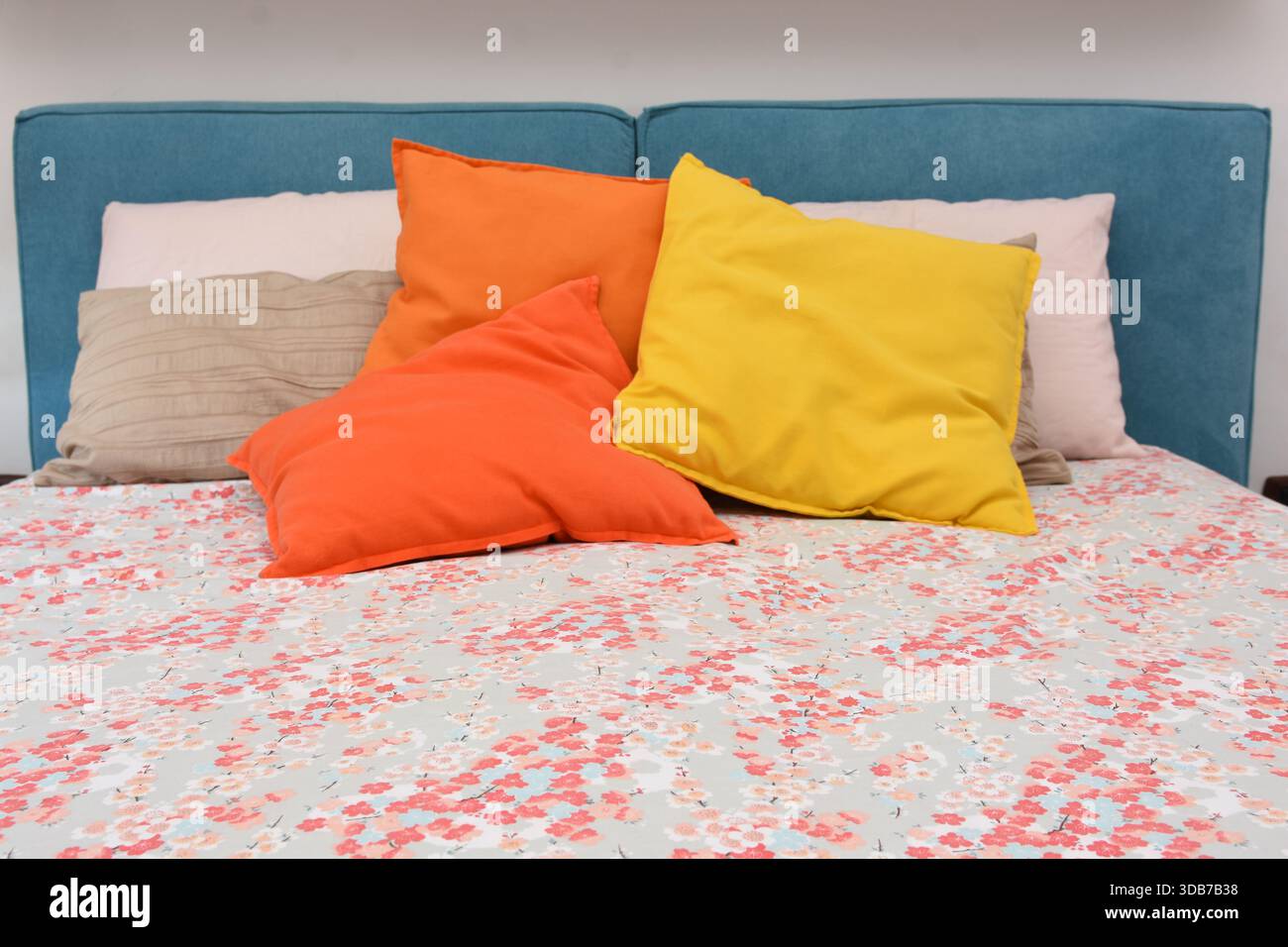 cushions representing autumn placed on the bed Stock Photo