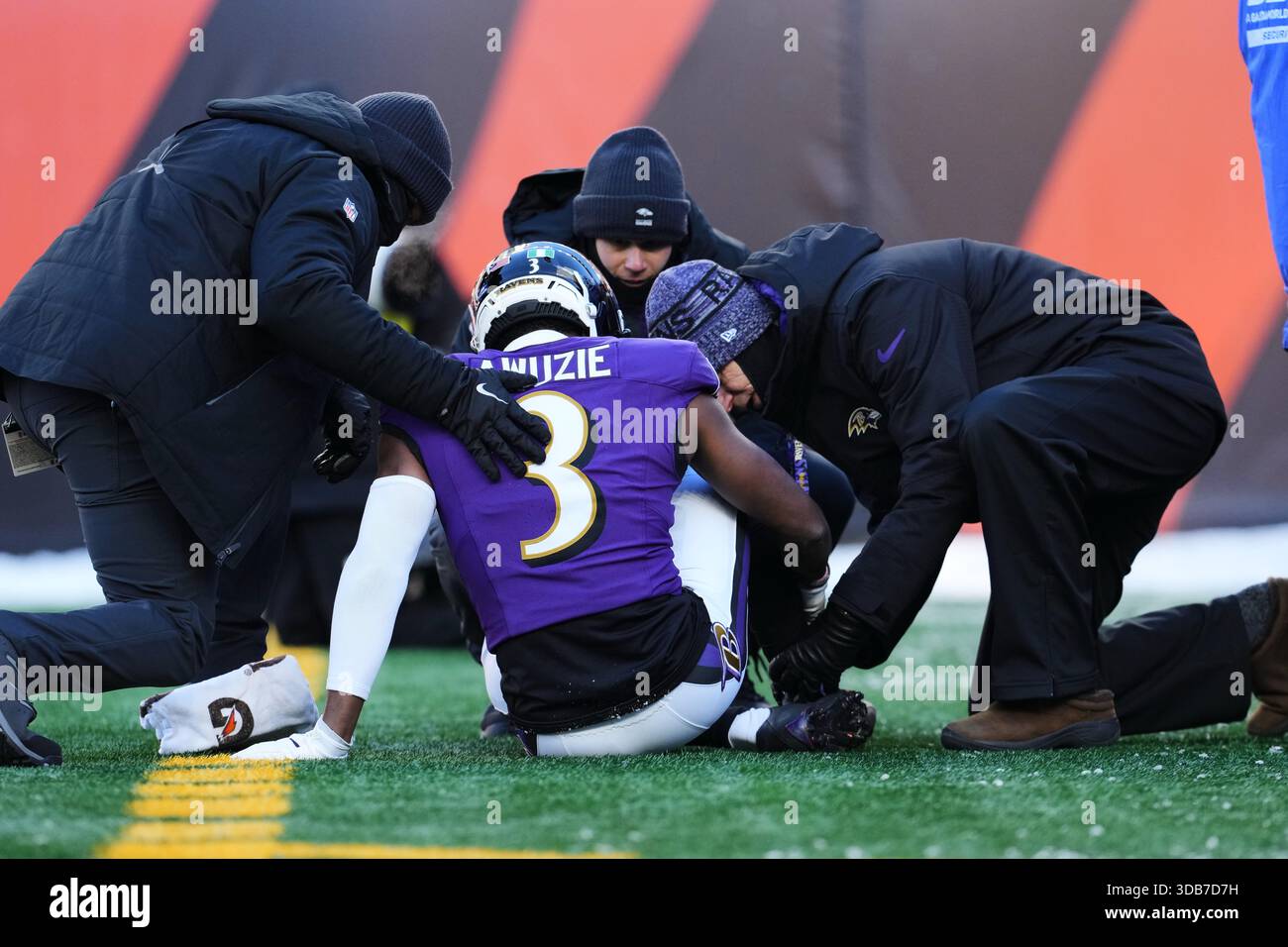Baltimore Ravens cornerback Chidobe Awuzie (3) is tended to by training ...