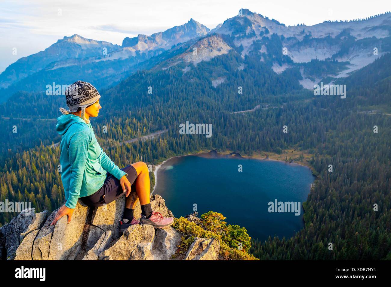 A woman is happily enjoying the stunning scenic view of Louise Lake and ...