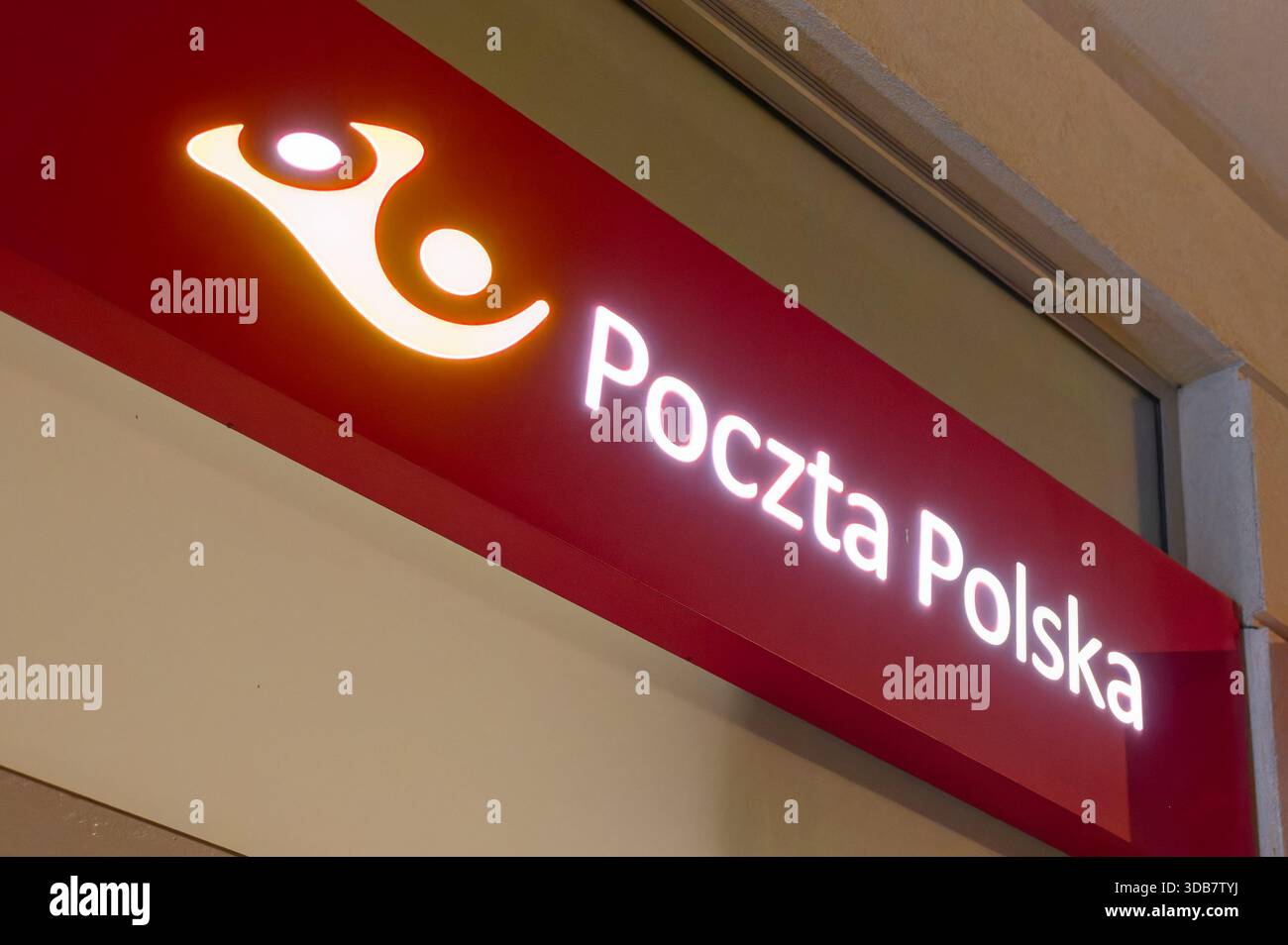 Poczta Polska post office sign with illuminated logo and lettering on  building facade, national postal service of Poland Stock Photo - Alamy, image size:1300x954