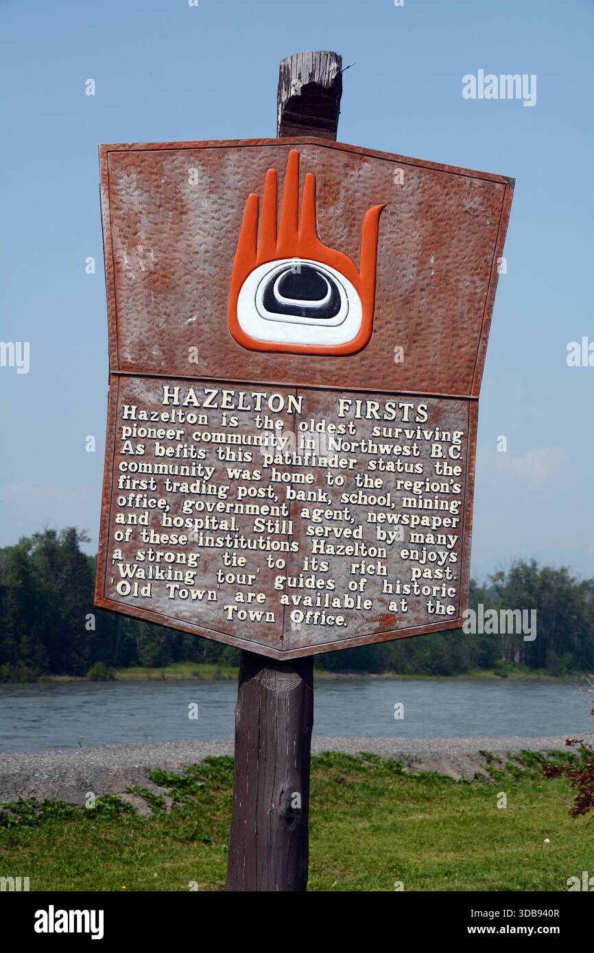 An indigenous historical plaque located on the banks of the Skeena River in the Gitxsan First Nation town of Hazelton, British Columbia, Canada. Stock Photo