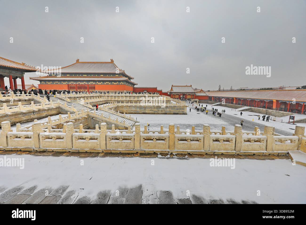 Tourists admire snow scenery at the Forbidden City in Beijing, China ...