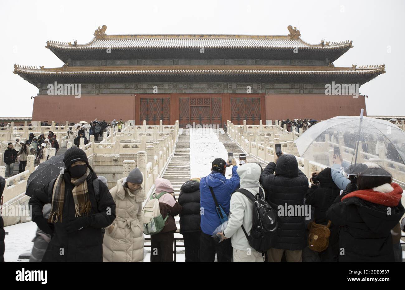 Tourists admire snow scenery at the Forbidden City in Beijing, China ...