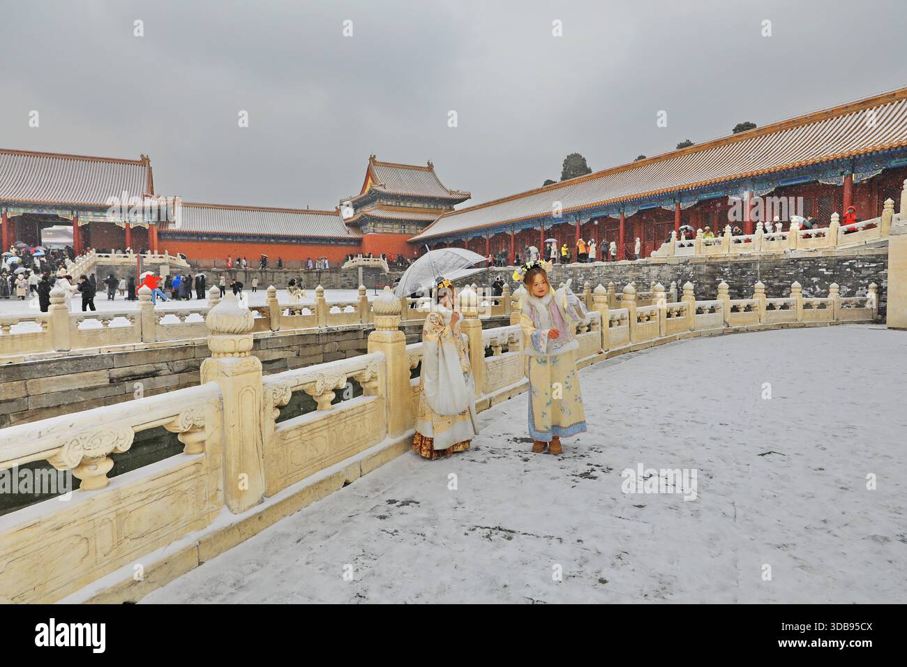 Tourists admire snow scenery at the Forbidden City in Beijing, China ...