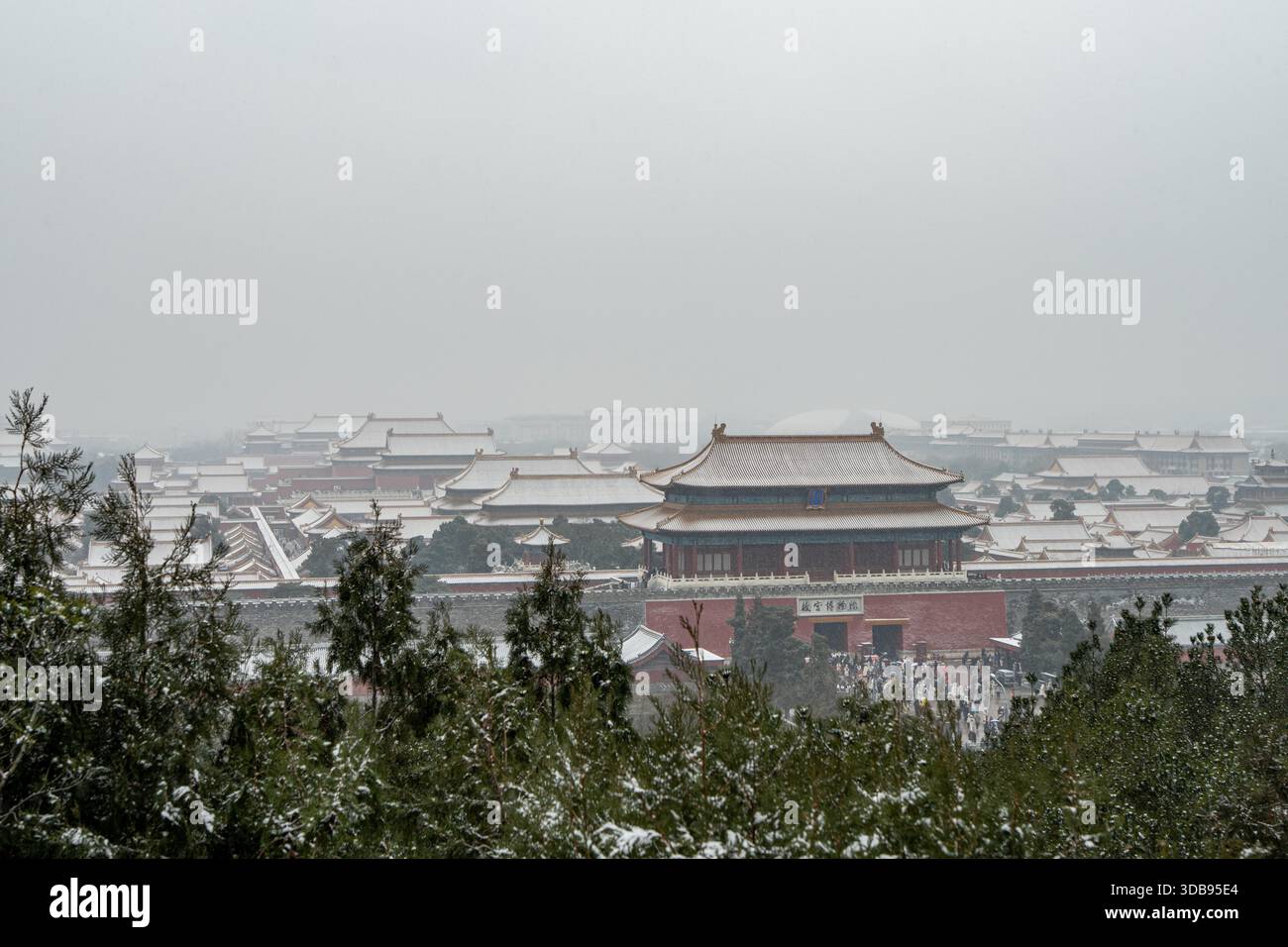 Tourists admire snow scenery at the Forbidden City in Beijing, China ...