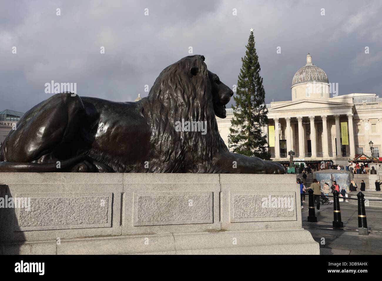 trafalgar square lions dressed for christmas Hundreds of raucous revellers dressed as Father Christmas dance the night away in Trafalgar Square