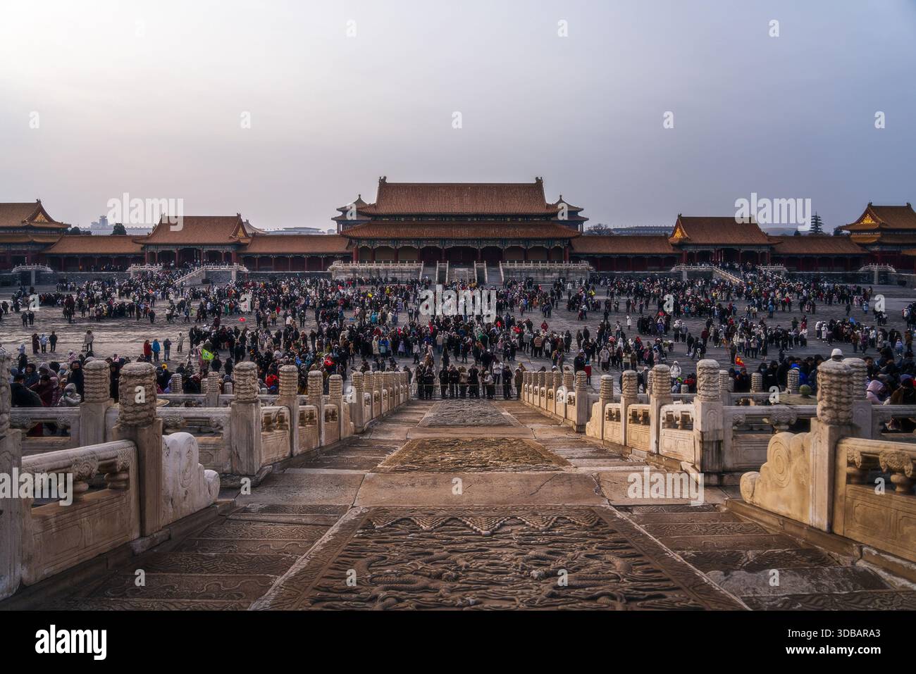 View of ancient architecture with crowds of people ascending the stairs and walking around the palace, Beijing, Beijing, China. Stock Photo