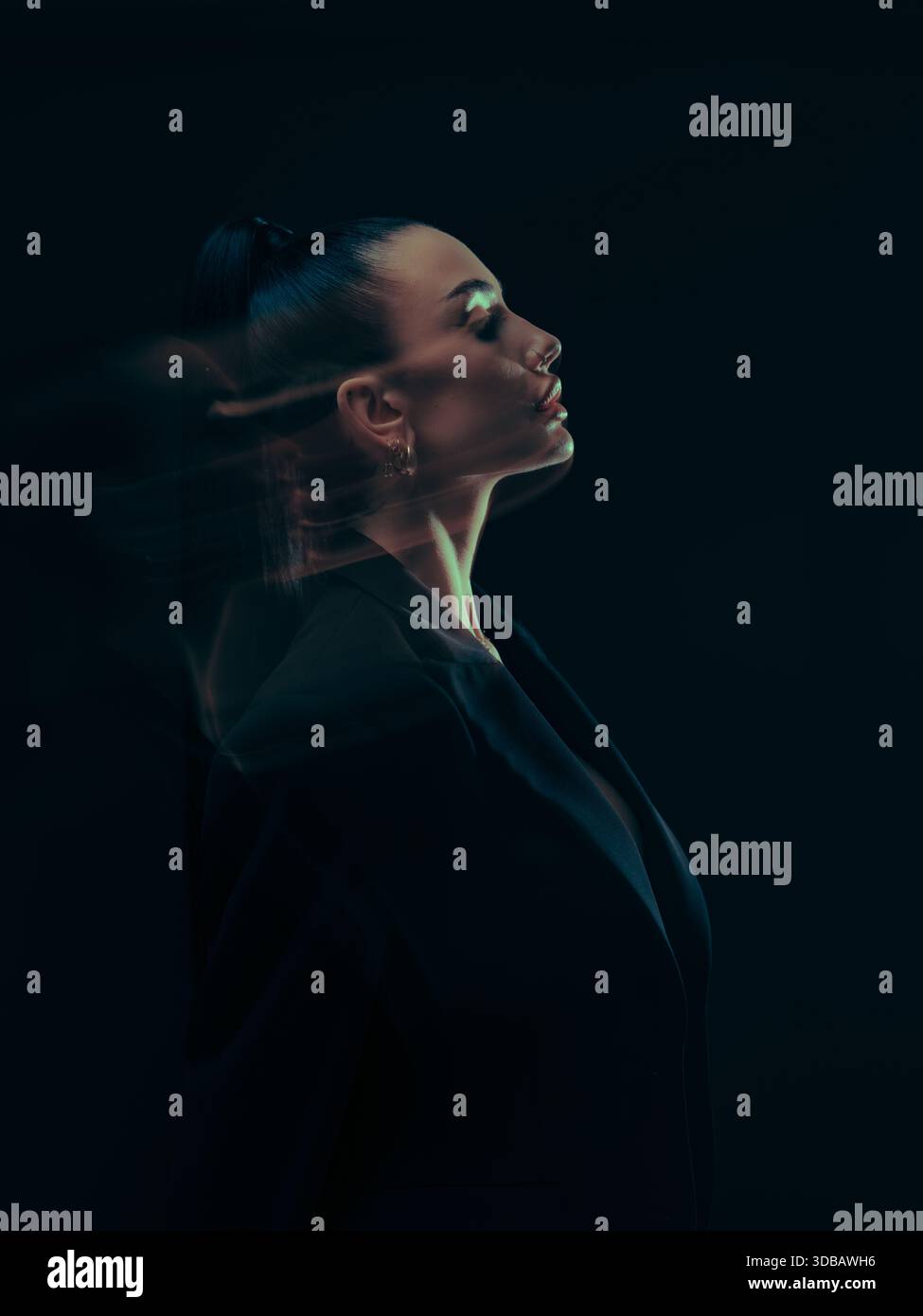 Dramatic portrait of a woman in upward profile, enhanced by flowing ...