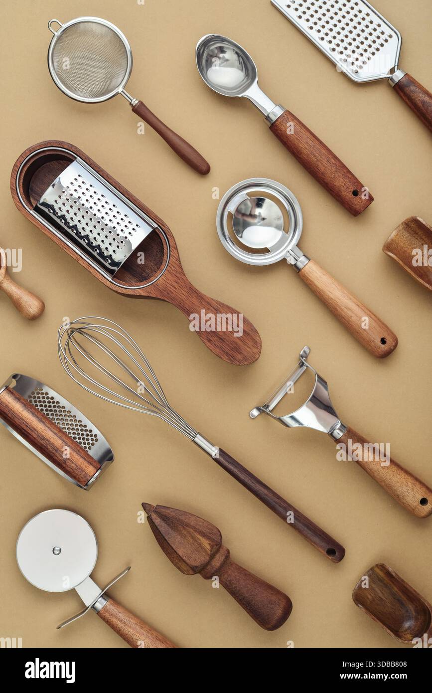 Various kitchen utensils or cooking tools on brown background, top view, flat lay Stock Photo