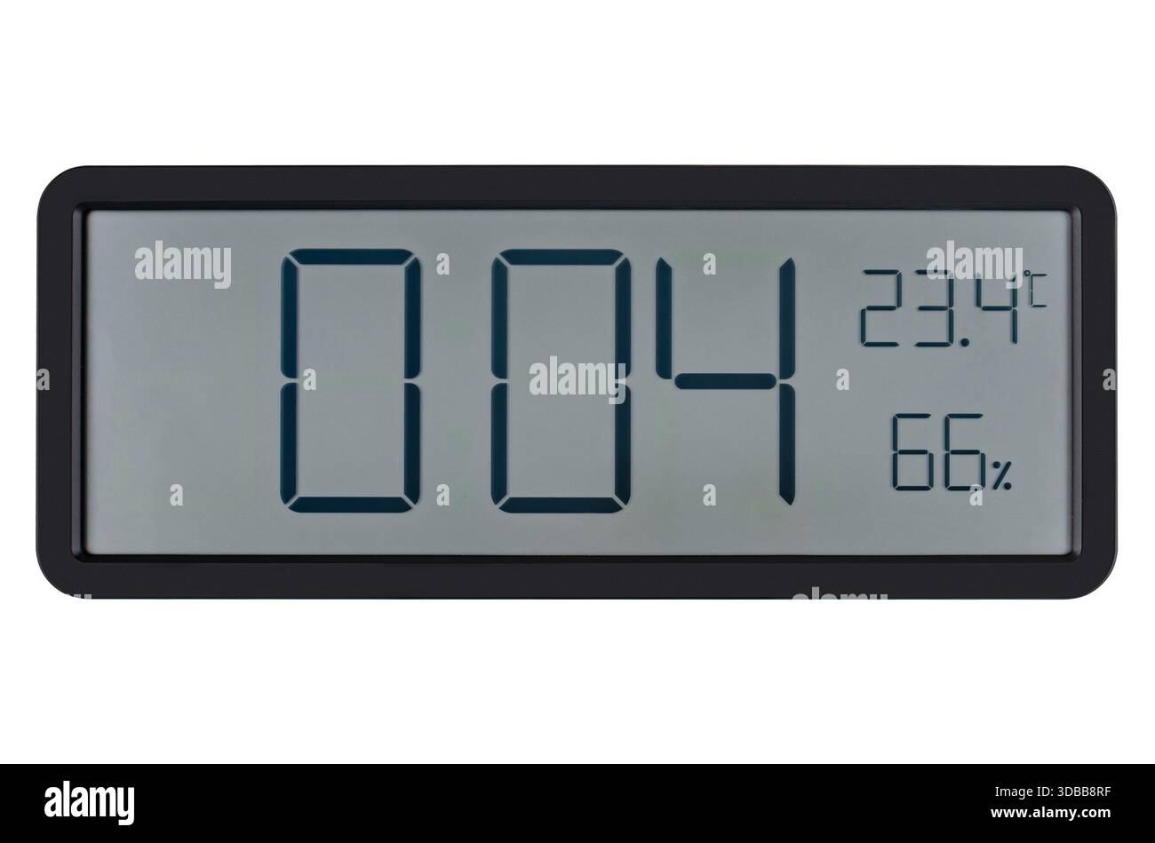 Large wall clock with white digits, alarm function and temperature measurement. On a white background in isolation. Stock Photo