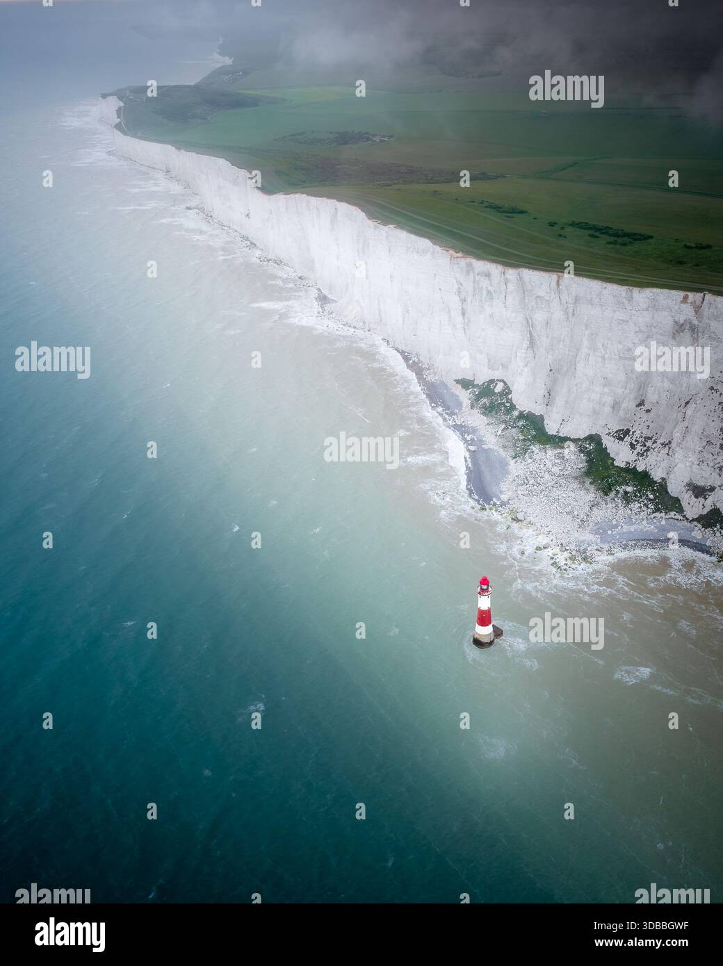Aerial view of the chalk cliffs meeting the turquoise sea, with the ...