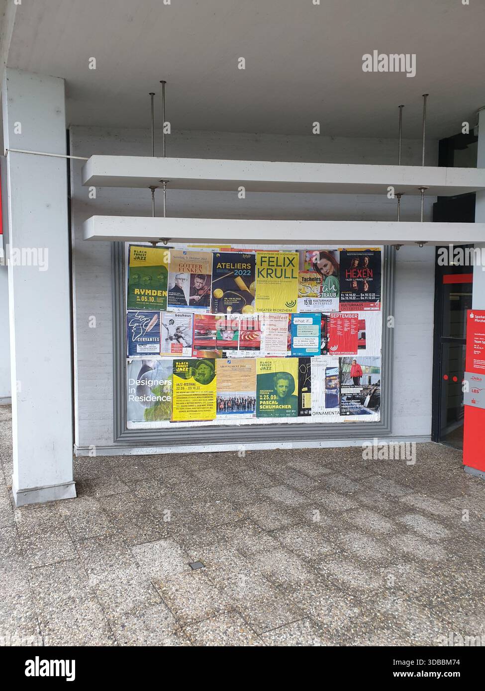 Bright urban poster arrangement at entrance, Eclectic mix of event ...