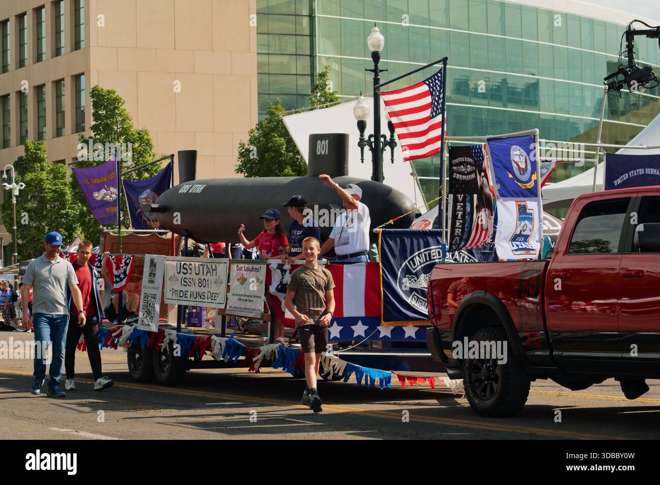 US Navy float in parade with community members celebrating local pride ...