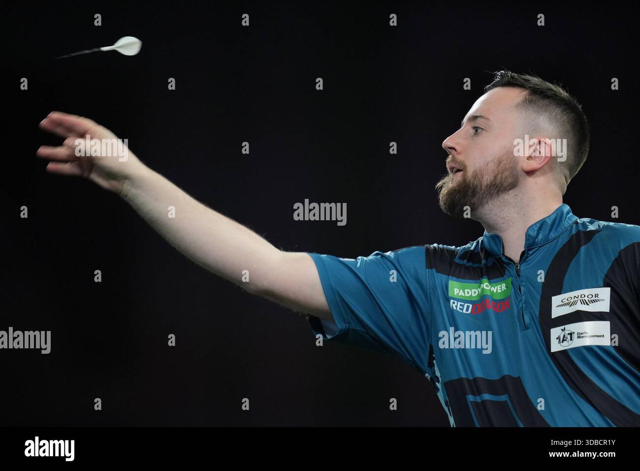 Connor Scutt of England throws a dart as he takes part in a round one ...