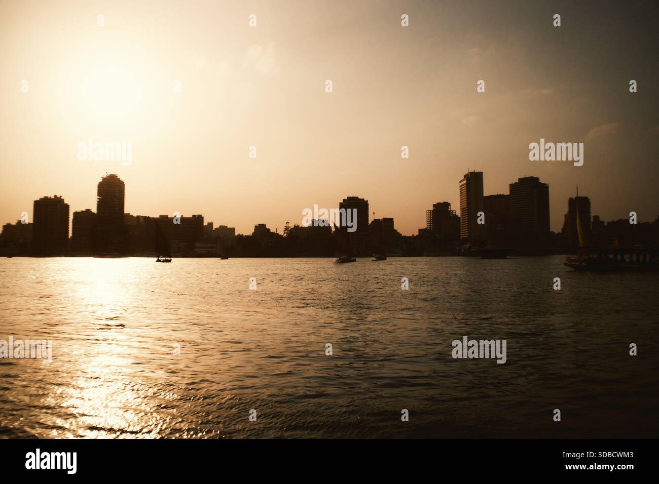 Sunset Reflection On The Nile River With Cairo Skyline Silhouette Stock ...