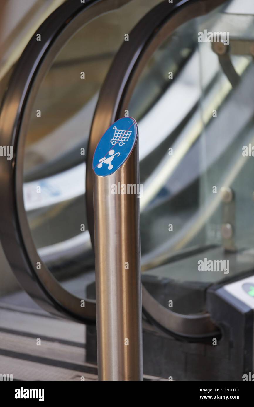 Shopping cart access point at an escalator location Stock Photo - Alamy