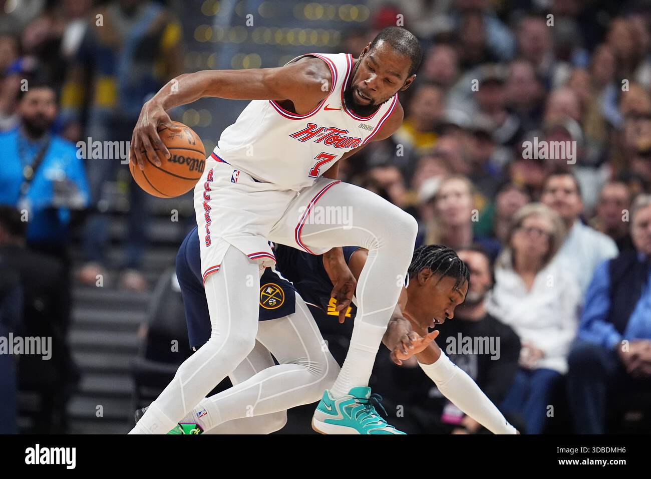 Houston Rockets forward Kevin Durant (7) collects the ball as Denver ...