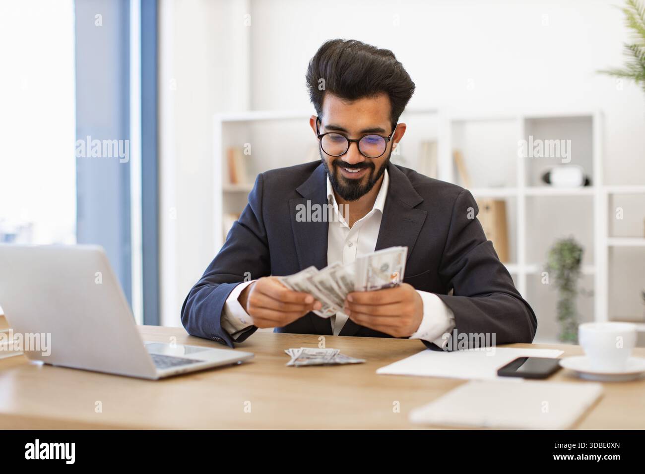 Indian Businessman Counting Money Stock Photo - Alamy