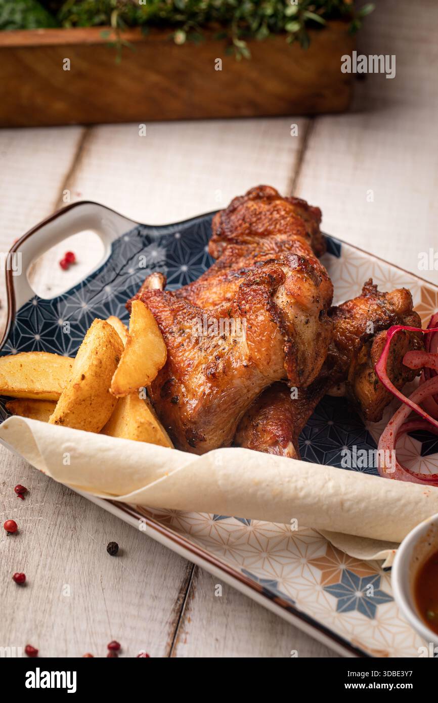 Grilled chicken wings with sauces plate Stock Photo