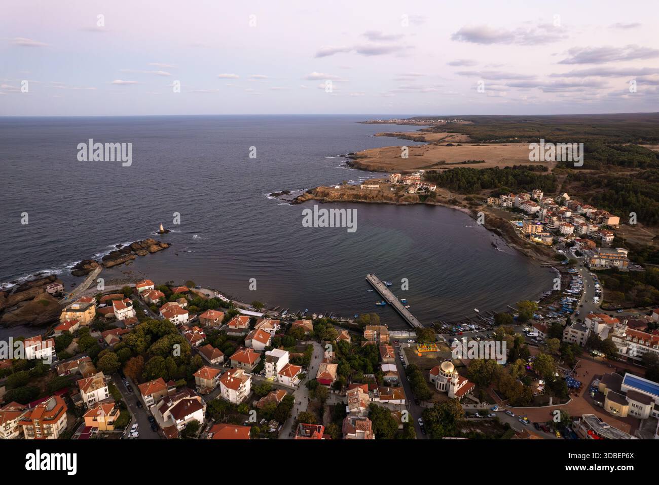 Aerial view of the tranquil bay embracing the quaint coastal town, where buildings stand in contrast to the vast expanse of the sea, Ahtopol Lighthous Stock Photo