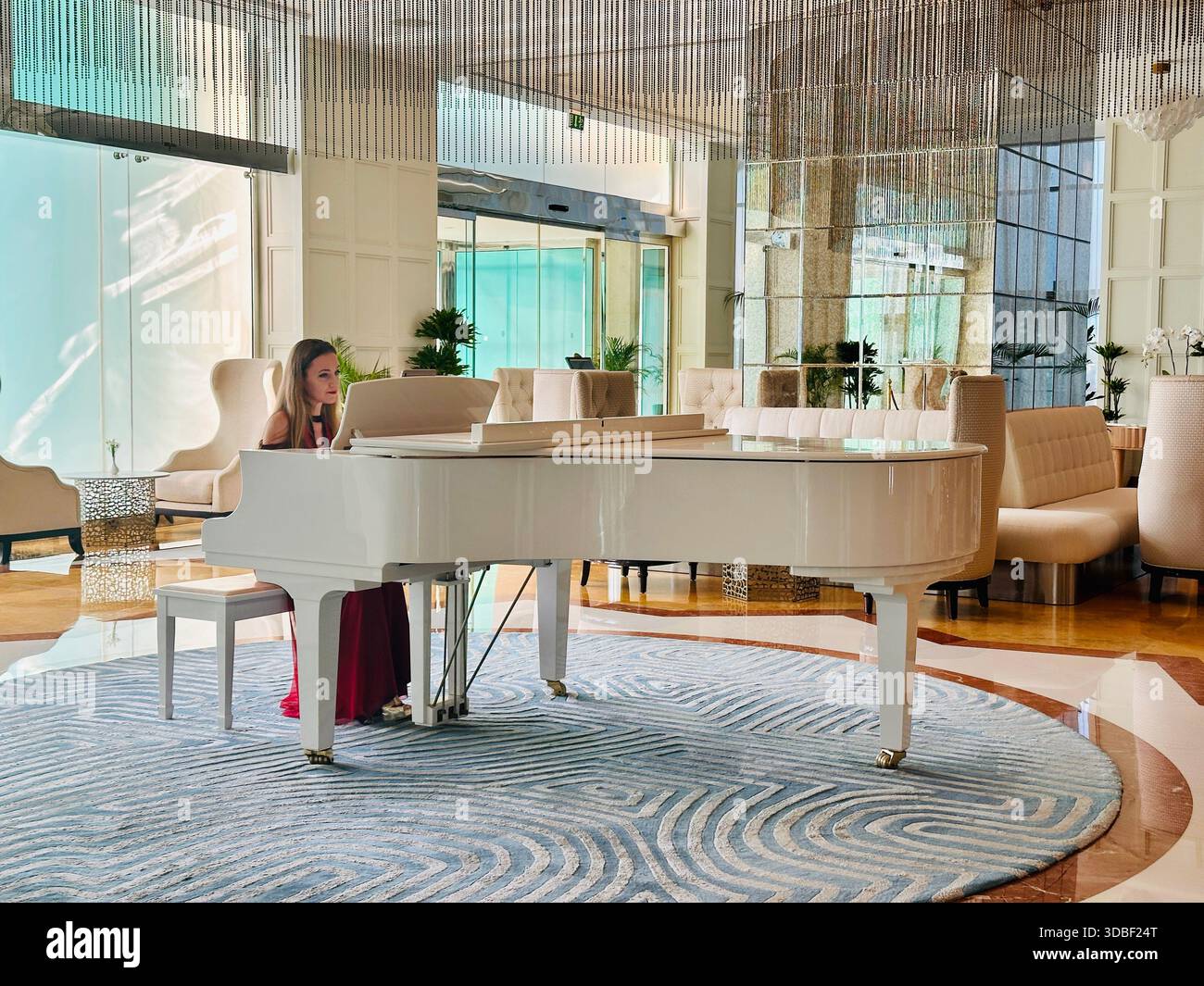 pianist playing the piano lobby bar Waldorf Astoria Hotel Ras al Khaimah - Smartphone Captured Stock Image