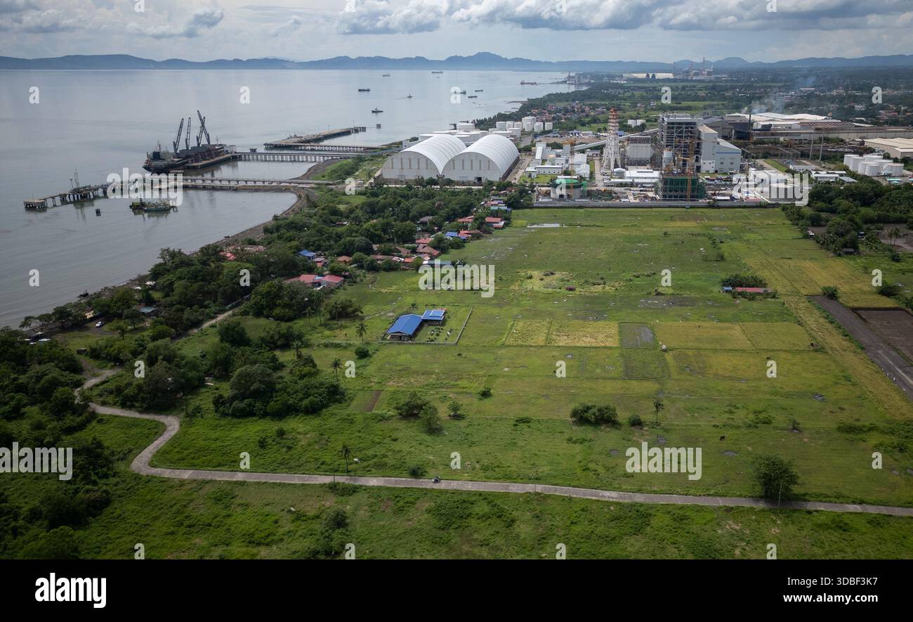 Rice fields surround the South Luzon Thermal Energy Power Plant in ...
