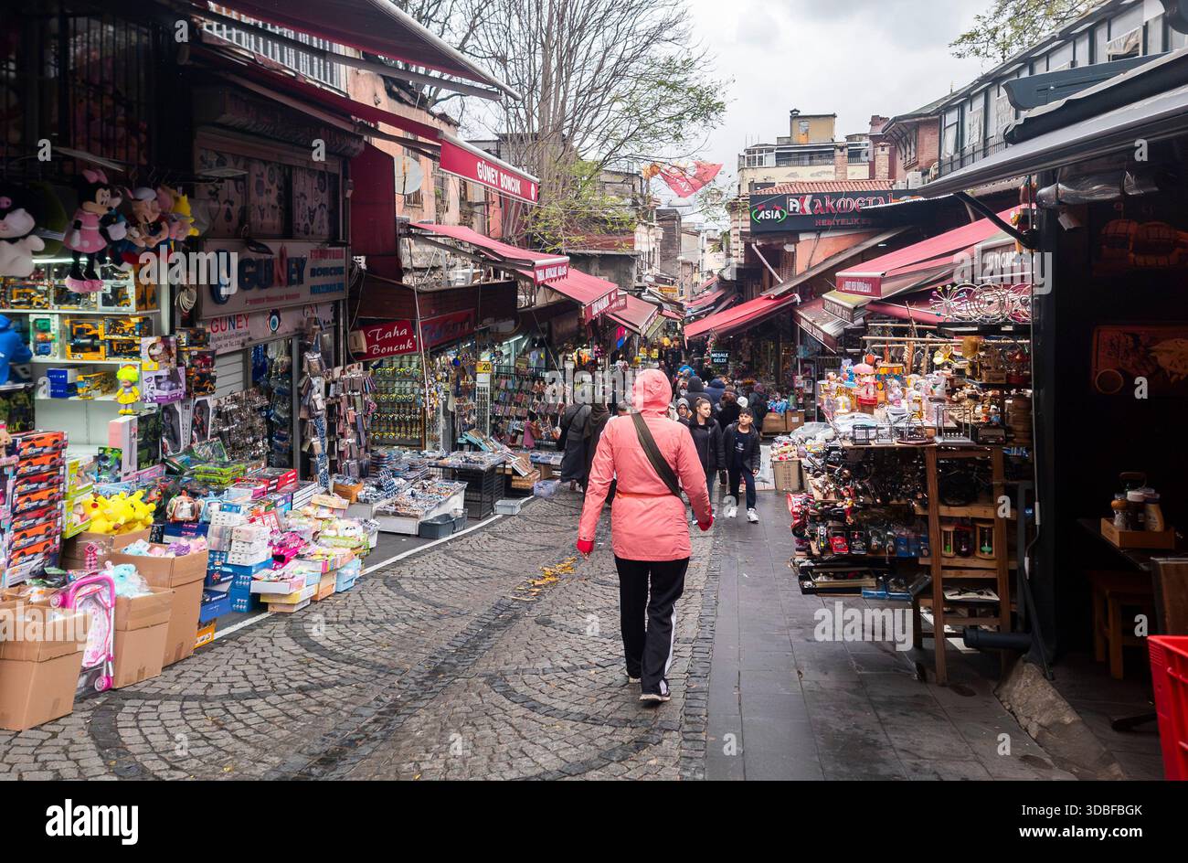 Istanbul, Turkey - 8th December, 2025, Woman walking through a vibrant ...
