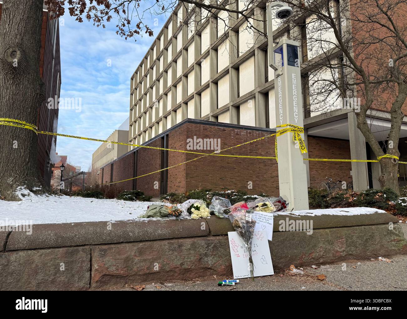 A memorial of flowers and signs lay outside the Barus and Holley ...