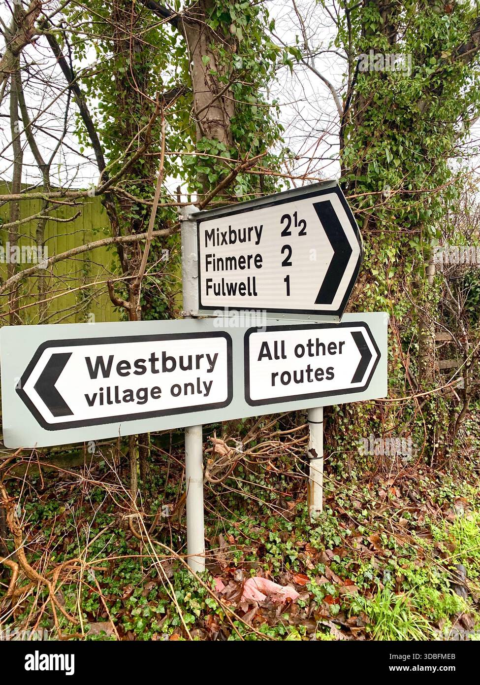 Directional road sign at a rural junction near Westbury Oxfordshire England indicating routes to Mixbury Finmere and Fulwell local village access - Smartphone Captured Stock Image