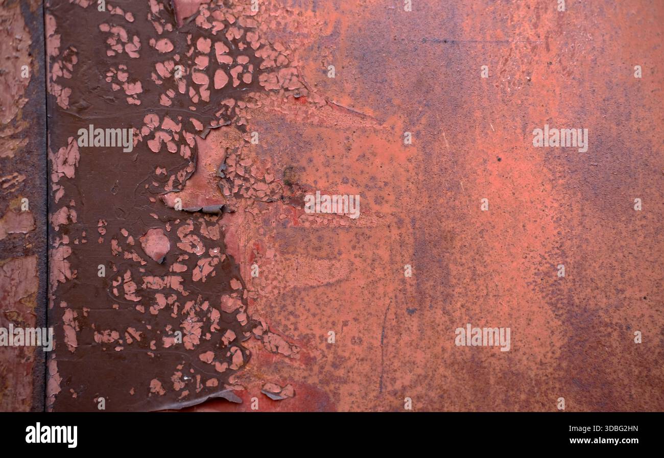 Extreme close-up of metal panel showing heavy corrosion, layered peeling  paint in brown and red tones, pitted texture, natural light, flat angle  Stock Photo - Alamy, image size:1300x897