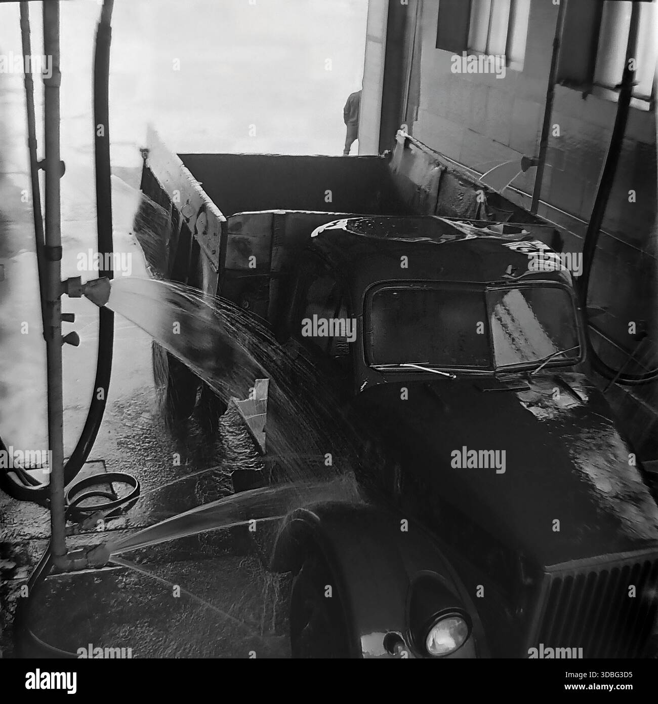 Black And White Archival Photo Capturing The Automated Washing Of A GAZ black-and-white-archival-photo-capturing-the-automated-washing-of-a-gaz