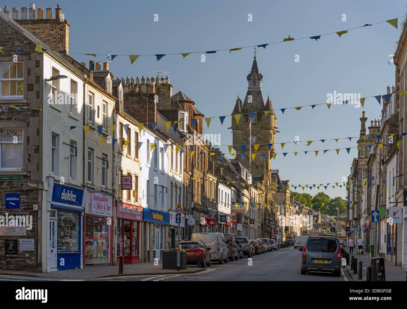Shops In Hawick Bustling Hawick main street in Scotland with bunting, shops and a ...