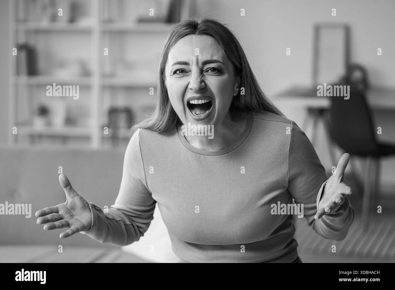 Angry mature woman at home. International Stress Awareness Week Stock ...