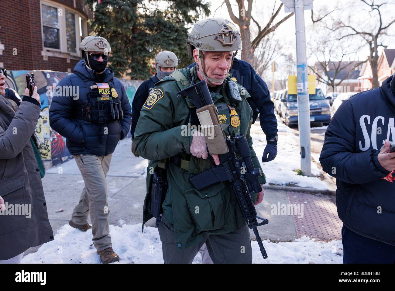 Border Patrol Cmdr. Gregory Bovino walks alongside his agents after ...