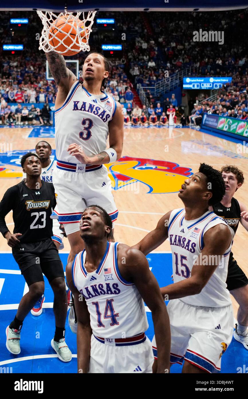 Kansas guard Tre White (3) dunks the ball during the first half of an ...