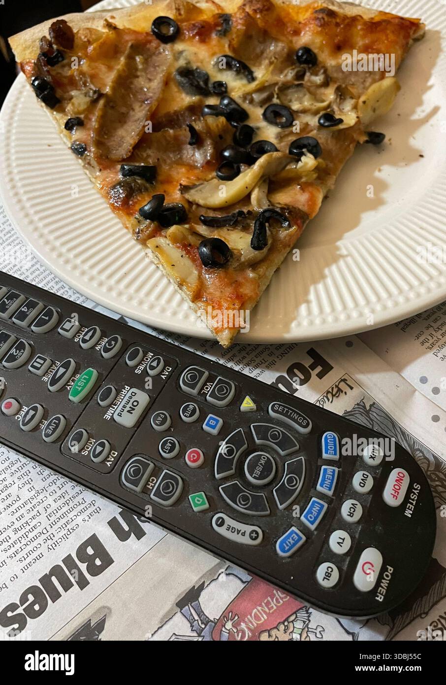 A slice of pizza in front of the TV for satisfying game day experience, 2025, United States - Smartphone Captured Stock Image