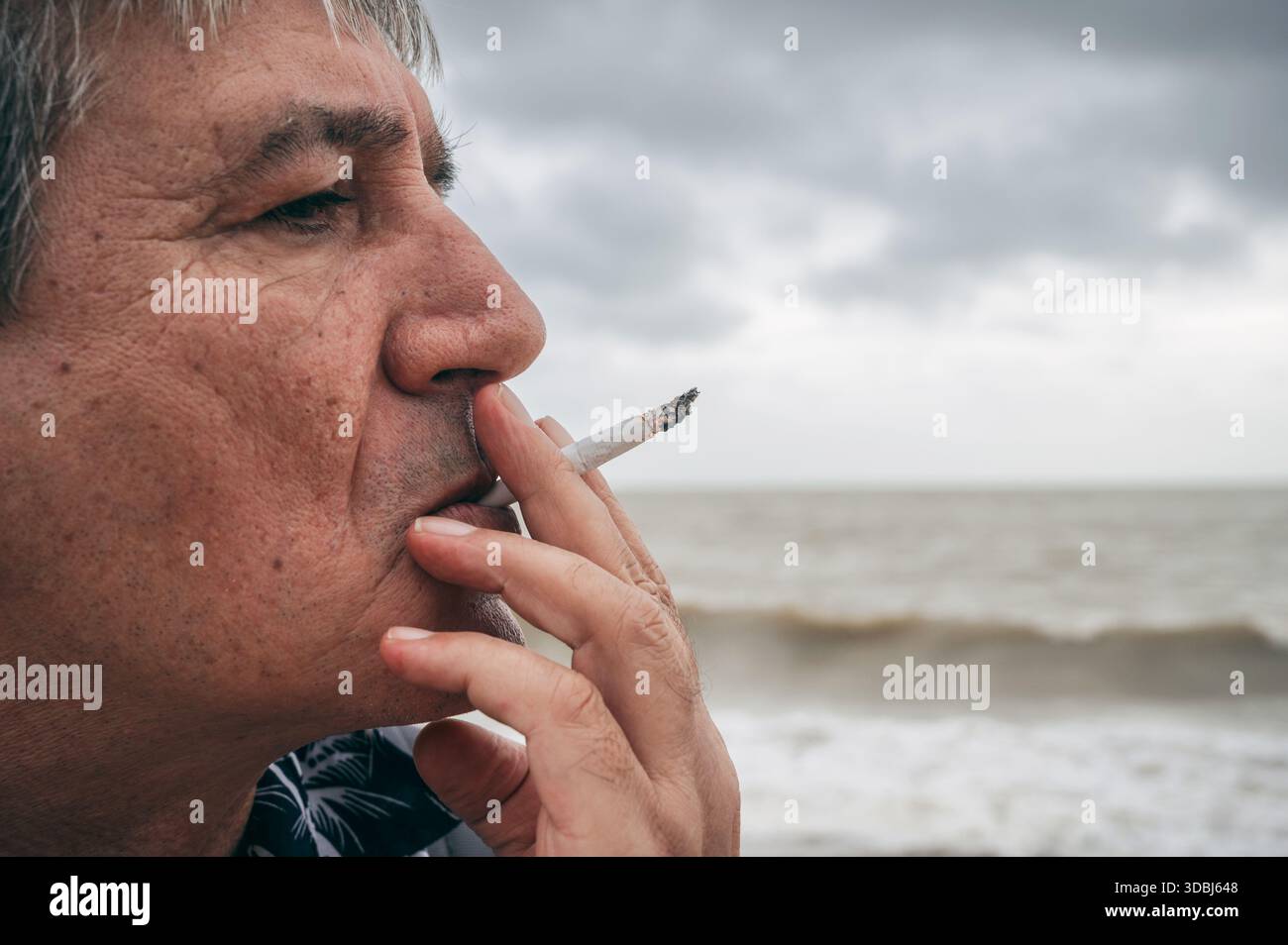 Sad person smoking hi-res stock photography and images