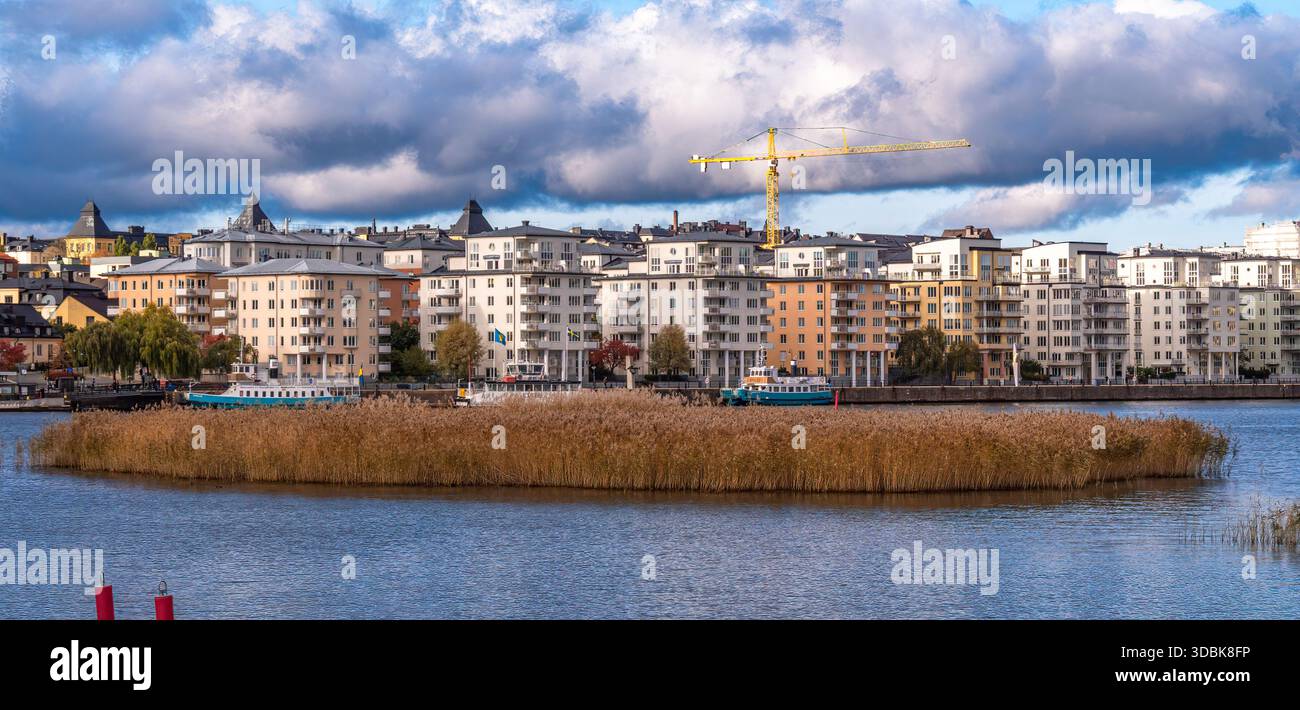 Image showcasing Stockholm, Sweden - 19 October 2025: Urban waterfront with modern ...