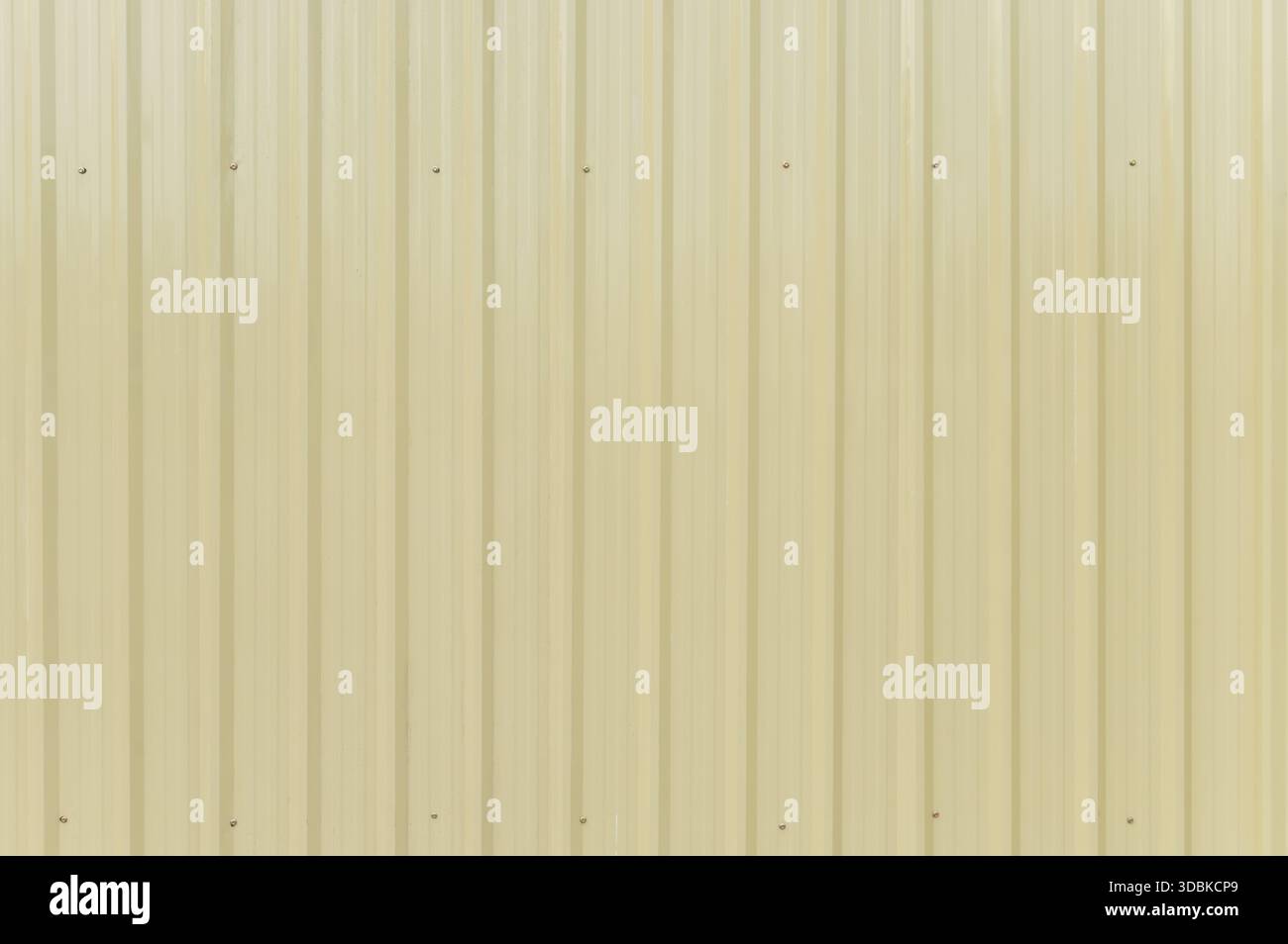 Pale yellow corrugated metal sheet background texture Stock Photo